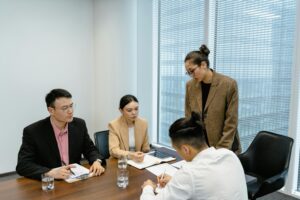 Employees in the middle of a meeting.